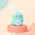 Nolya Kids DinoKid teal U-shape kids toothbrush on coral podium